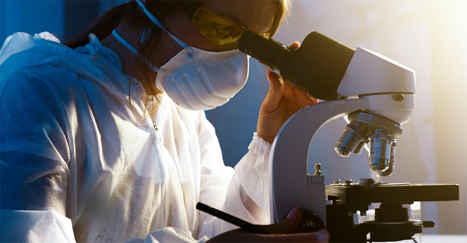 researcher with microscope